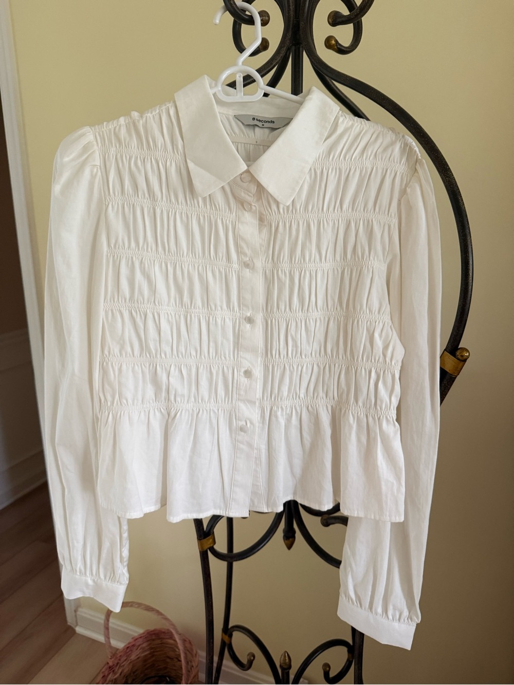 Smocked White Button-Down Blouse with Peplum Hem